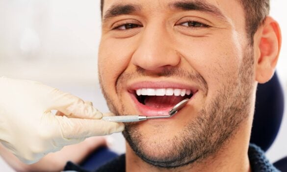dentist examining Affordable Dental Implants in Orlando